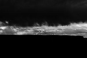 Black and white shot of clouds over the Grand Canyon at sunset 
