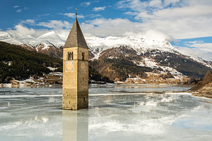 Flooded church tower in Lake Reschen Reschensee in South Tyrol Italy