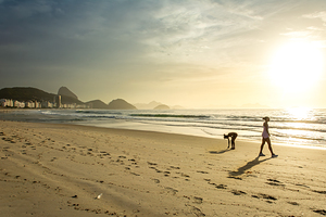Two women at Copacabana Beach in Rio de Janeiro in Brazil at sunrise 