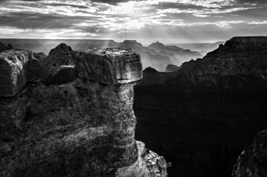 Black and white shot of the sunrise over the Grand Canyon