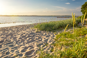 Sunset at a peaceful beach in Glücksburg at the Flensburger Förde in North Germany