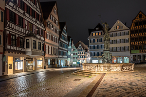 Night shot of the main town square and scenic fountain in Tübingen