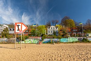 Typical houses at the waterfront and city beach at the Elbe River in Hamburg Germany 