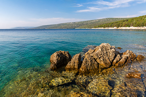 Scenic rock formations in a beautiful bay at the Adriatic Sea on the island of Losinj in Croatia