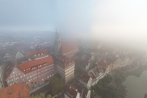 Aerial view of the historic old town of Tübingen in the morning fog