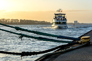 Quay and ferry in Hamburg Övegönne during golden sunset 