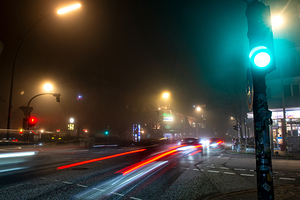 Long exposure night shot of a lit up streetcorner in Hamburg Altona