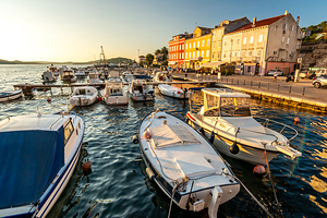 Boats in the marina of Mali on the island of Losinj in the Adriatic Sea in Croatia during beautiful sunset