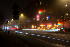 Long exposure night shot of lit up streetlight and road in Hamburg Altona