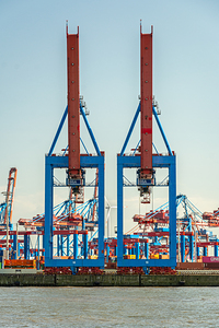 Cranes at a container terminal in the port area of Hamburg Germany editorial