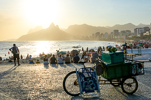 Bicycle and coconuts at the promenade of Ipanema Beach in Rio de Janeiro in Brazil at sunset  