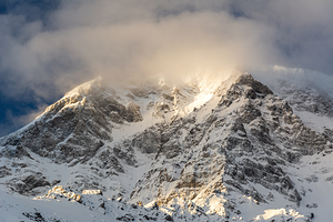 Sun rays shining through the clouds on a gorgeous morning at the Ortler Mountain in South Tyrol 