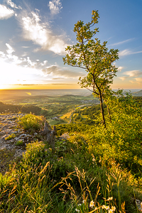 Scenic sunset over a rock ledge Wackerstein in the Swabian Alps in Southern Germany