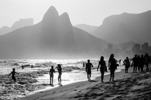 Black and white shot of people enjoying Ipanema Beach in Rio de Janeiro 