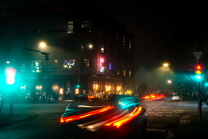 Long exposure night shot of lit up streetlight and road in Hamburg Altona