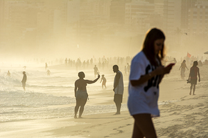 People at Ipanema Beach in Rio de Janeiro in Brazil at sunset  