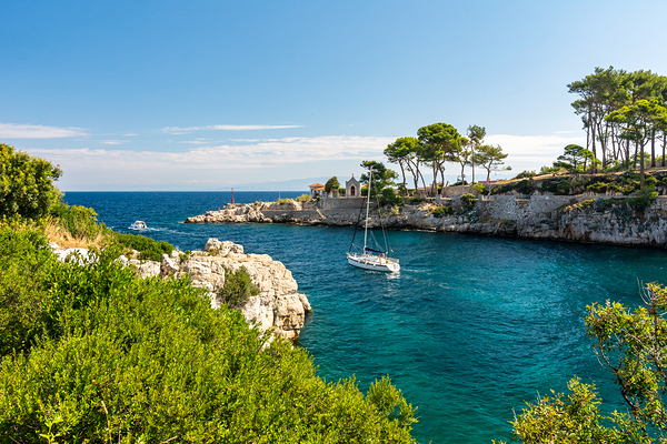 Sailing yacht leaving the beautiful harbour of Veli Losinj Croatia Print