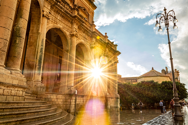 Sun shining through beautiful baroque building in Noto Sicily Italy Print