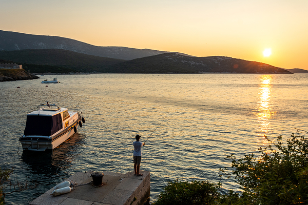 Lonely fisherman in the beautiful bay of Osor on the island of Cres-Losinj in the Adriatic Sea Croatia Print