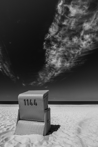 Black and white shot of beach chair at the North Sea on the island of Sylt  Print