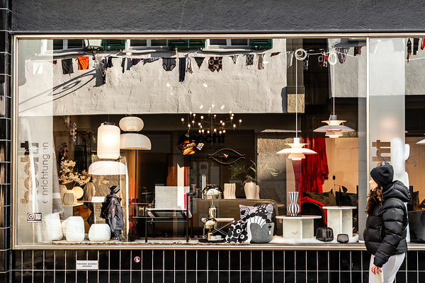 Street photo of reflections in a stylish furniture shop window in the city Print