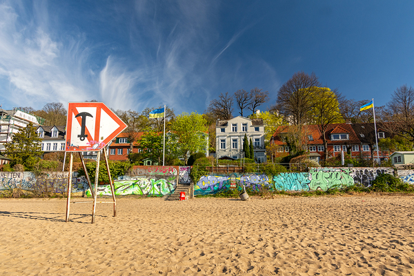 Typical houses at the waterfront and city beach at the Elbe River in Hamburg Germany  Print