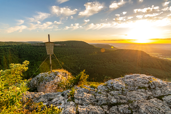 Beautiful sunset over a rock ledge and summit cross Wackerstein in the Swabian Alps in Southern Germany Print