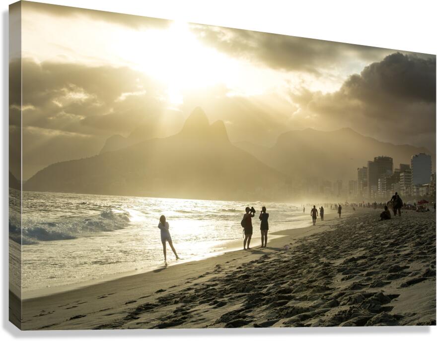 People enjoying dramatic sunset at Ipanema Beach in Rio de Janeiro  Canvas Print