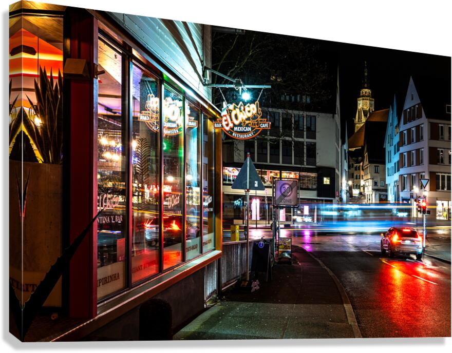 Night shot of restaurant and blurred car lights on a main street in Tübingen Canvas Print