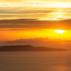 Island of Favignana in front of Trapani on Sicily during dramatic colourful sunset 