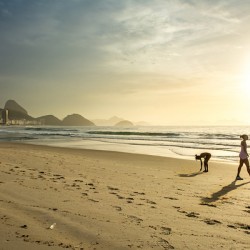 Two women at Copacabana Beach in Rio de Janeiro in Brazil at sunrise 