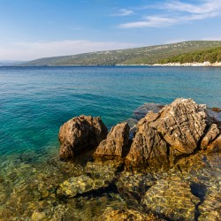 Scenic rock formations in a beautiful bay at the Adriatic Sea on the island of Losinj in Croatia
