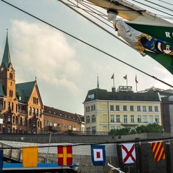 St. Pauli Landungsbrücken in Hamburg with famous historic sailing boat Rickmer Rickmers in the foreground