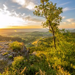 Scenic sunset over a rock ledge Wackerstein in the Swabian Alps in Southern Germany