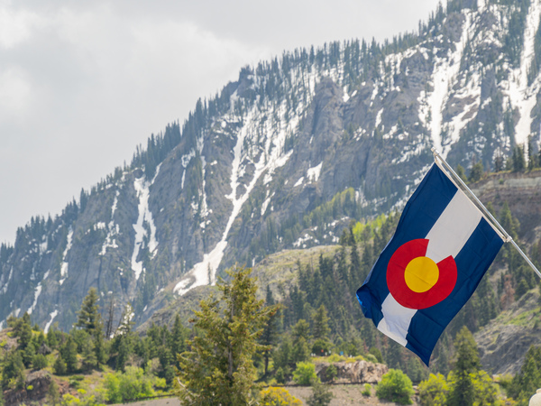 Close up shot of Colorado flag in Ouray by Kit Leong