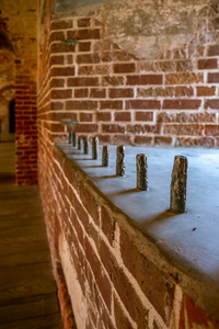 Forgotten Fortitude: Weathered Bars in Fort Macon