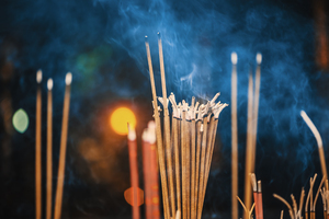 Incense sticks burning with smoke