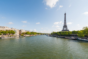 Paris and Eiffel tower with river Seine in the foreground on a sunny day