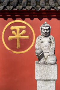 Soldier sculpture and red wall in wenshu monajpg