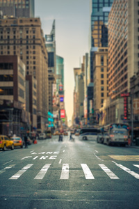 Tilt-shift view of a crosswalk in a New-York city avenue