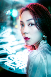 Young Chinese woman portrait with neon lights