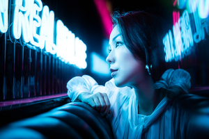 Young Chinese woman portrait with neon lights