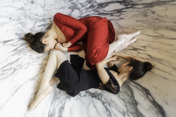 Two ballerinas lying down in a bathtub Print