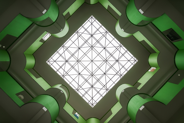 Modern building green atrium directly below view by Philippe Lejeanvre
