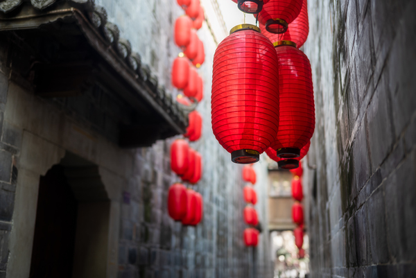 Red Chinese lanterns low angle view by Philippe Lejeanvre