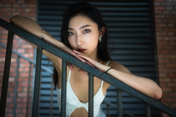 Young woman in a staircase close up portrait by Philippe Lejeanvre