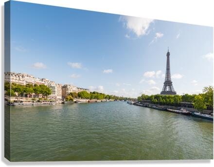 Paris and Eiffel tower with river Seine in the foreground on a sunny day Canvas Print
