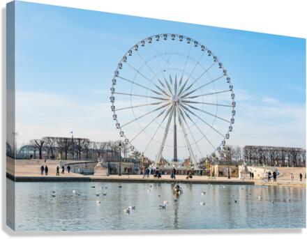 Paris ferris-wheel against blue sky from the Tuileries park Canvas Print