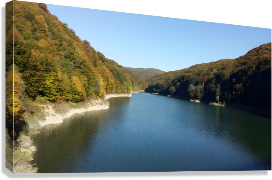 A stunning landscape of mountains trees and green leaves with water - Romania Canvas Print