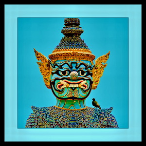 A YAK TEMPLE GUARD WITH A BIRD ON HIS SHOULDER - THAILAND